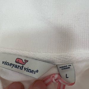 White new vineyard vine polo shirt with tags.